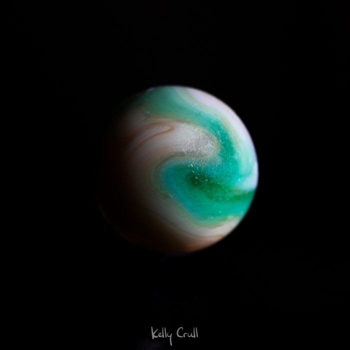 photo of planet made out of a marble by Kelly Crull